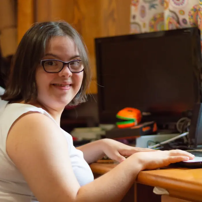 Disabled girl learning how to use the computer